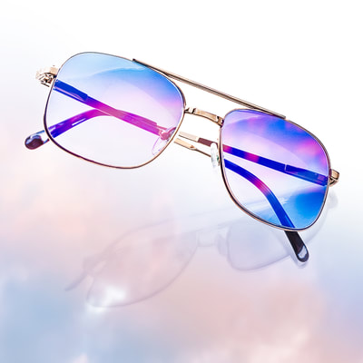 high quality product photography image of a pair of sunglasses with blue and red reflexion shoot in a photo studio 